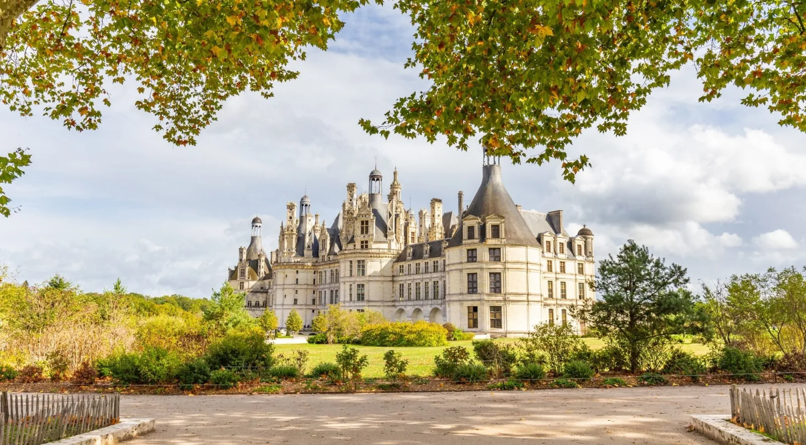 Château de Chambord's roofline of chimneys and turrets seen from the park