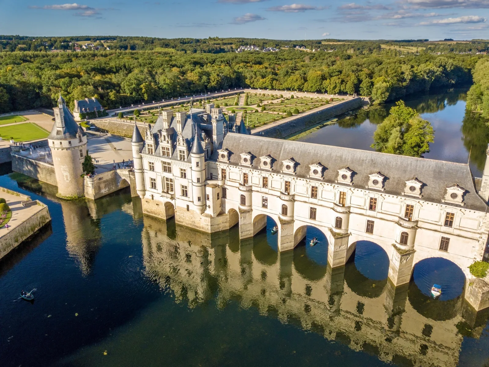 Aerial view of Château de Chenonceau's arched gallery spanning the River Cher