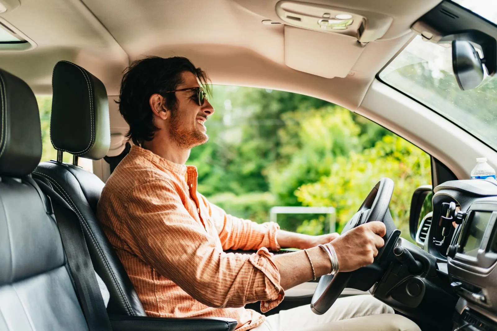 The driver at the wheel of the tour minivan on a Loire country road