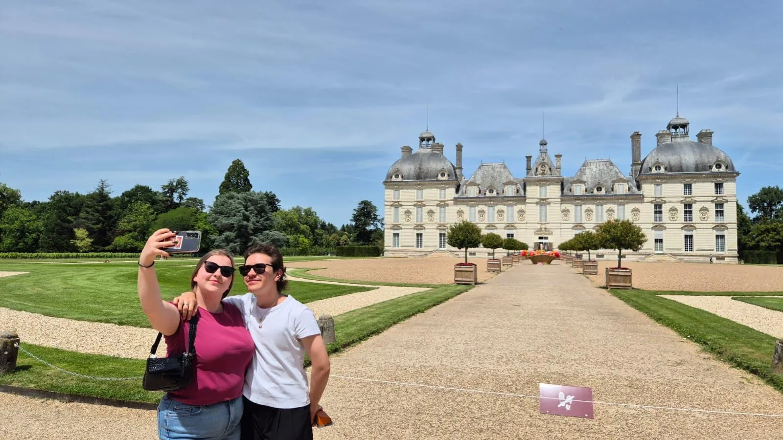Visitors on the long gravel approach to Château de Cheverny