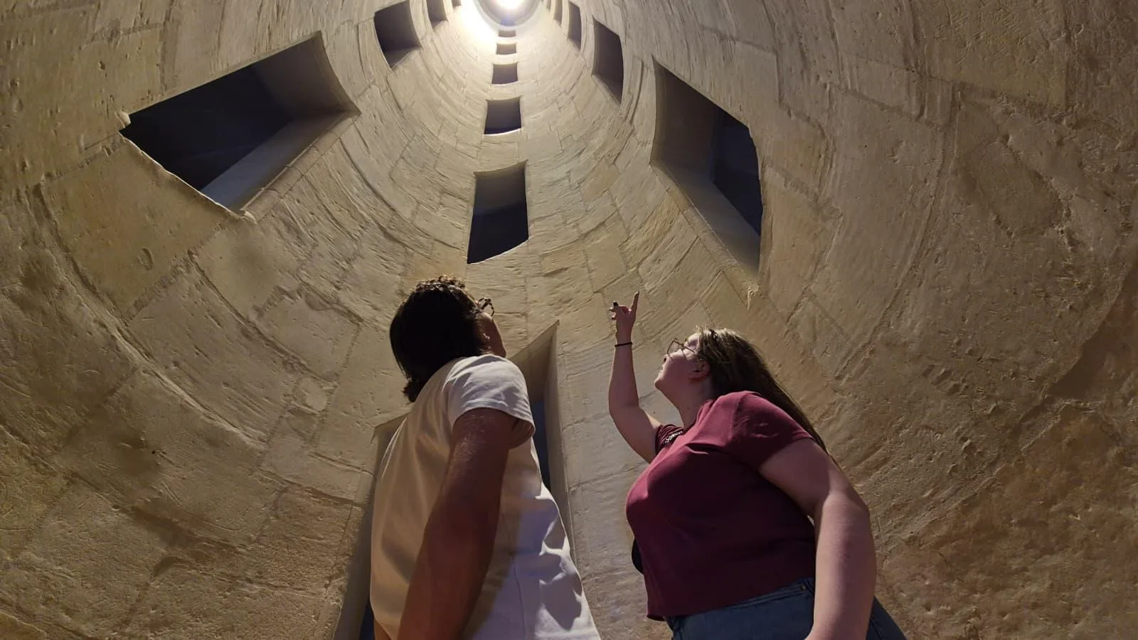 Visitors looking up inside Chambord's double-helix staircase